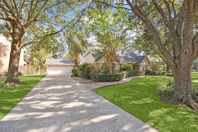 view of front of home featuring a front yard and a garage