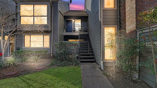 view of exterior entry at dusk