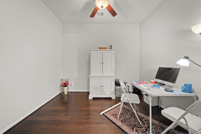 office space featuring dark hardwood / wood-style floors and ceiling fan