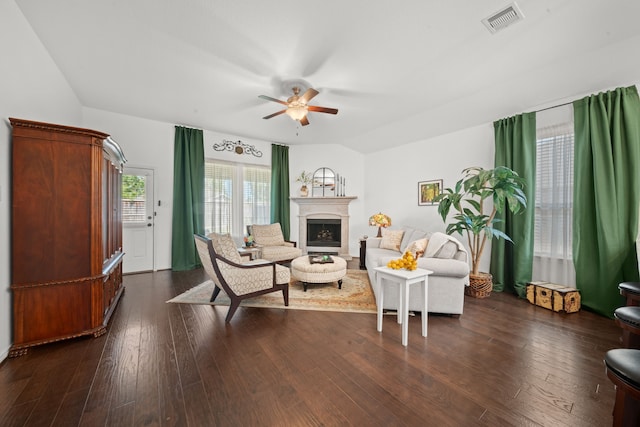 living room with ceiling fan and dark hardwood / wood-style floors