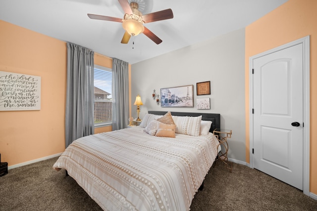 bedroom featuring dark carpet and ceiling fan