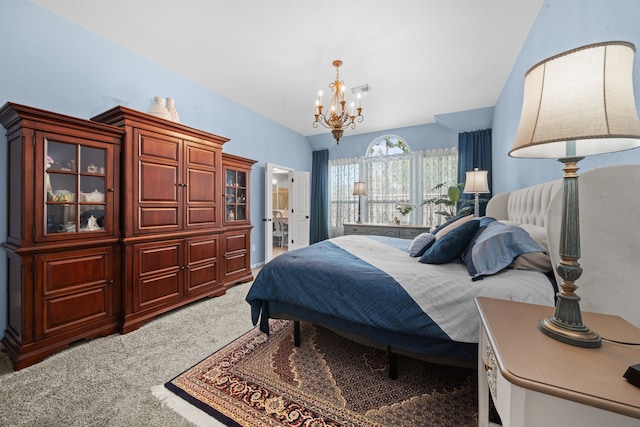 bedroom with carpet floors, a chandelier, and vaulted ceiling