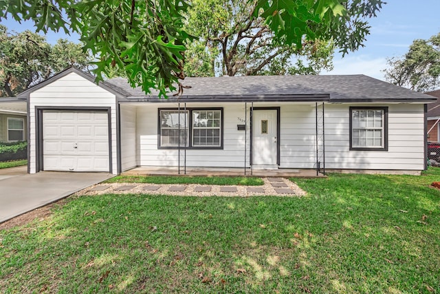 ranch-style house with a front yard and a garage