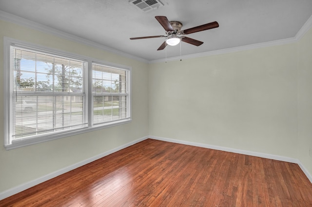 spare room with hardwood / wood-style flooring, ceiling fan, and crown molding