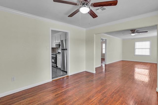 empty room featuring hardwood / wood-style flooring, ceiling fan, and crown molding