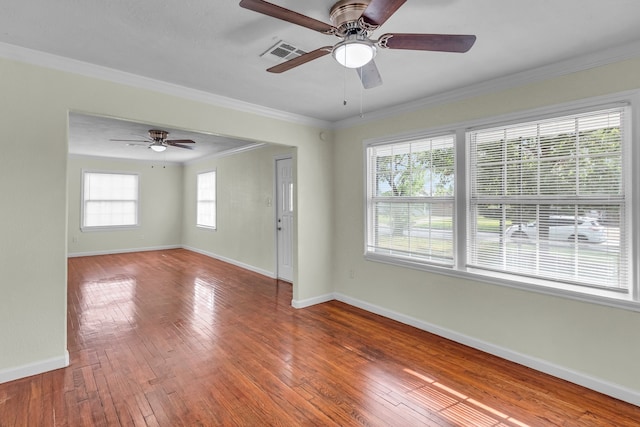 unfurnished room with hardwood / wood-style flooring, ceiling fan, and ornamental molding