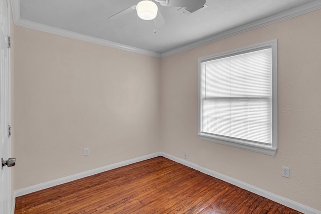 empty room with ceiling fan, wood-type flooring, and ornamental molding