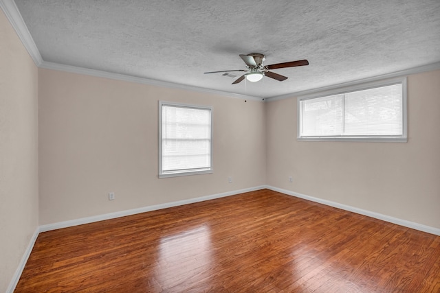 unfurnished room featuring ceiling fan, crown molding, wood-type flooring, and a textured ceiling