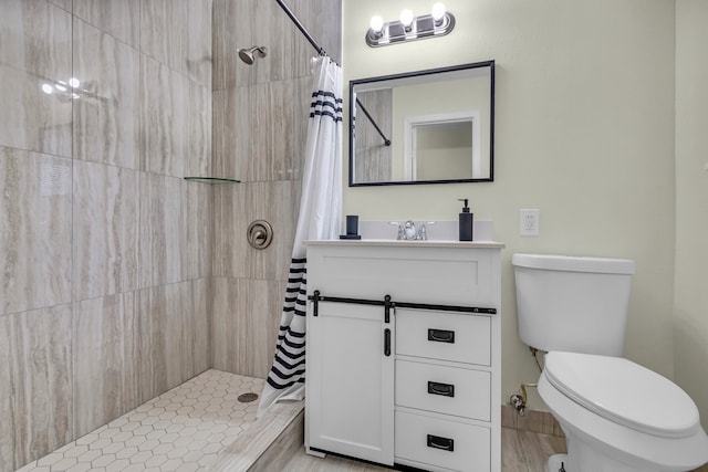 bathroom with a shower with curtain, vanity, and toilet