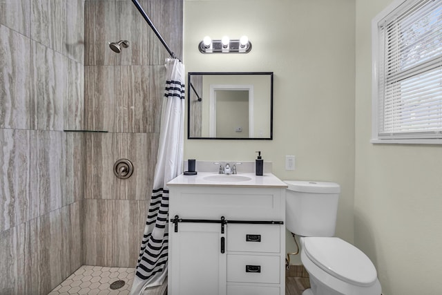 bathroom featuring a shower with curtain, vanity, and toilet