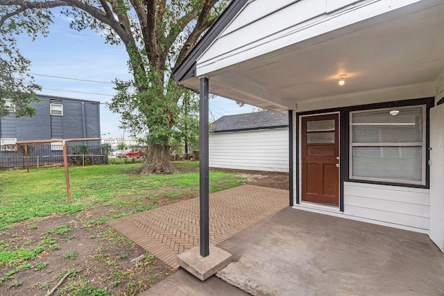 exterior space with a patio area and a lawn