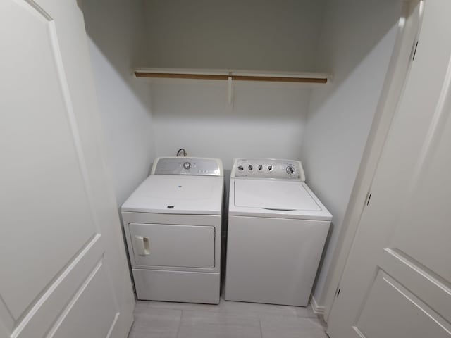 laundry area featuring washing machine and clothes dryer