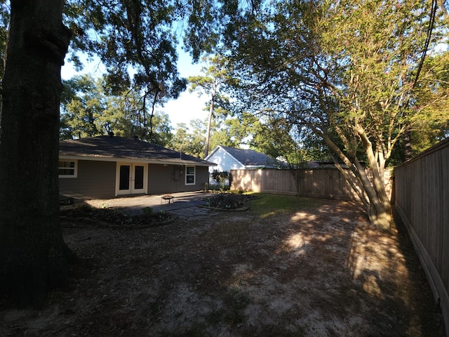 view of yard with french doors