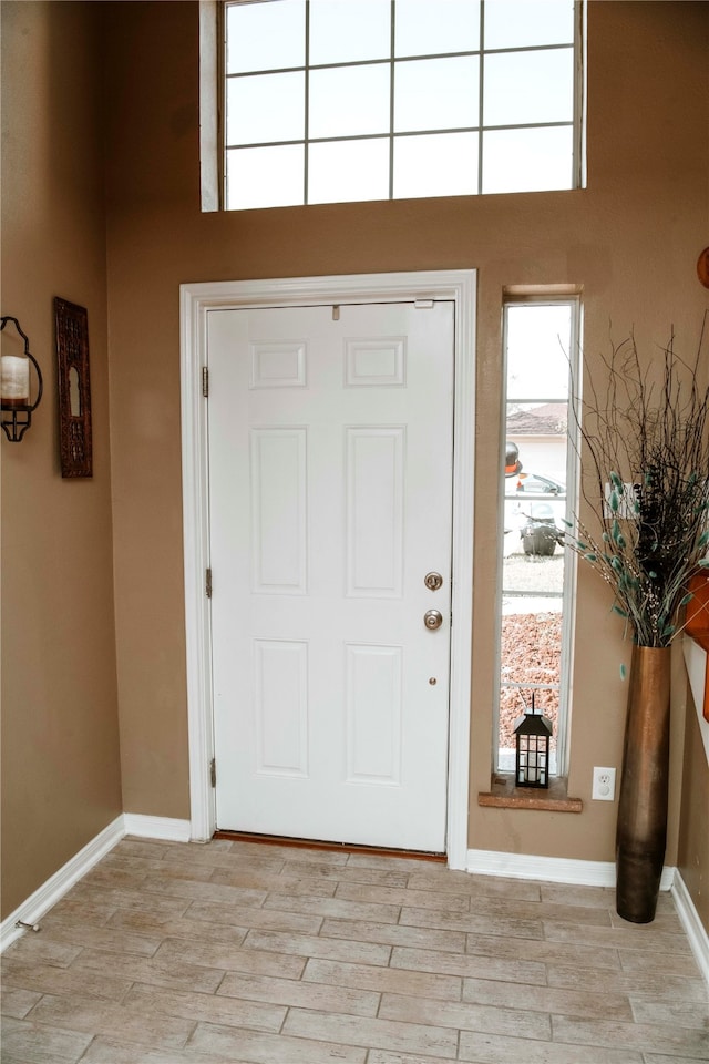 entrance foyer with light hardwood / wood-style floors and a wealth of natural light