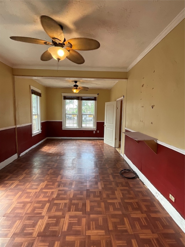 unfurnished room with dark parquet floors, a textured ceiling, ceiling fan, and crown molding