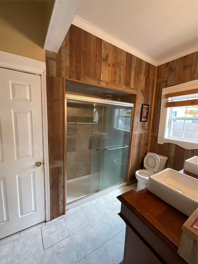 bathroom featuring toilet, wood walls, an enclosed shower, and ornamental molding