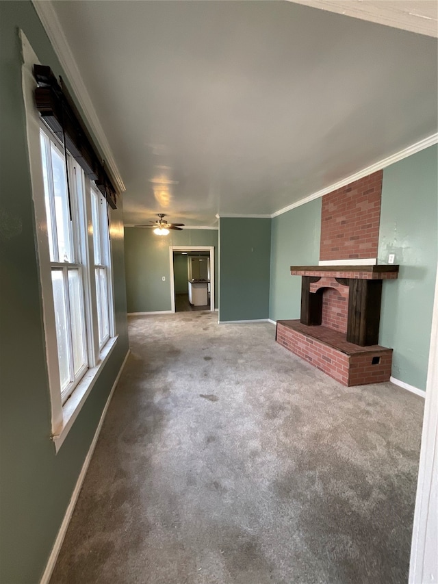 unfurnished living room featuring carpet flooring, a healthy amount of sunlight, and a fireplace