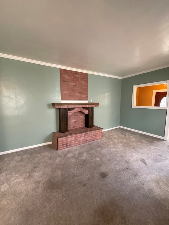 unfurnished living room featuring carpet floors, crown molding, and a brick fireplace