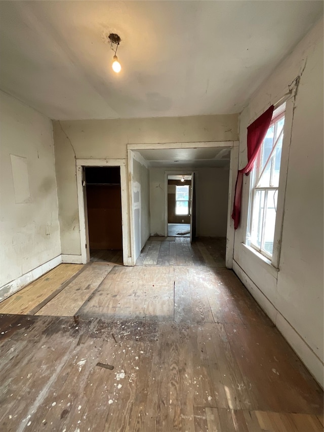 empty room with hardwood / wood-style floors