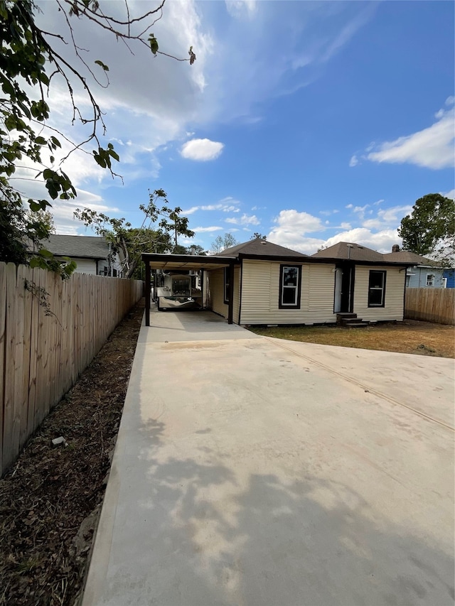 exterior space with a carport