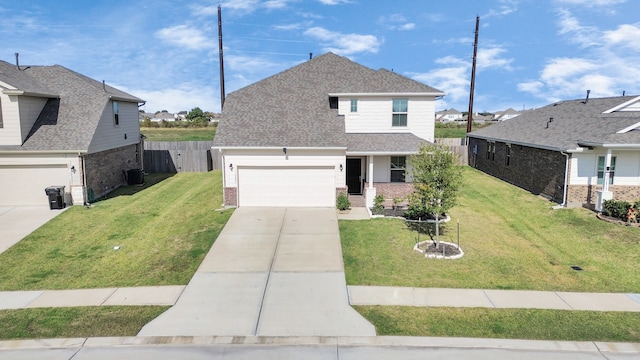 view of front facade featuring a garage and a front lawn