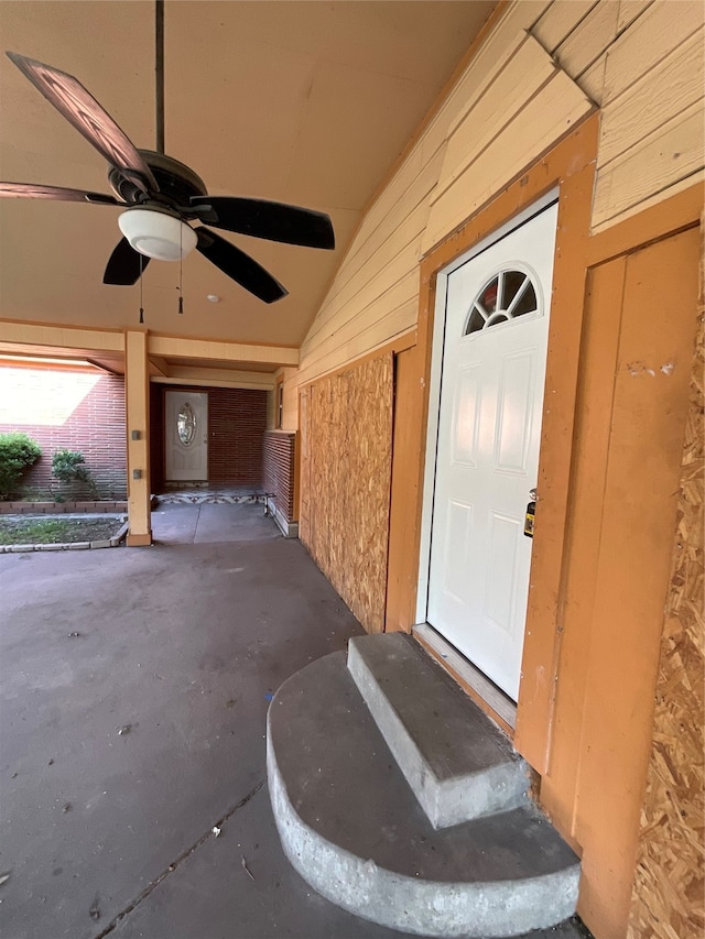 doorway to property with ceiling fan