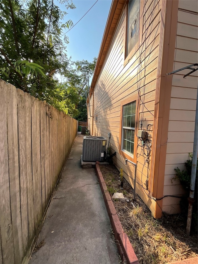 view of home's exterior with cooling unit