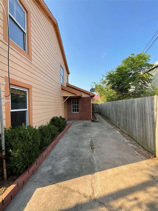 view of side of home featuring a patio area