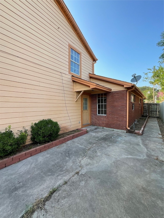 rear view of property featuring a patio