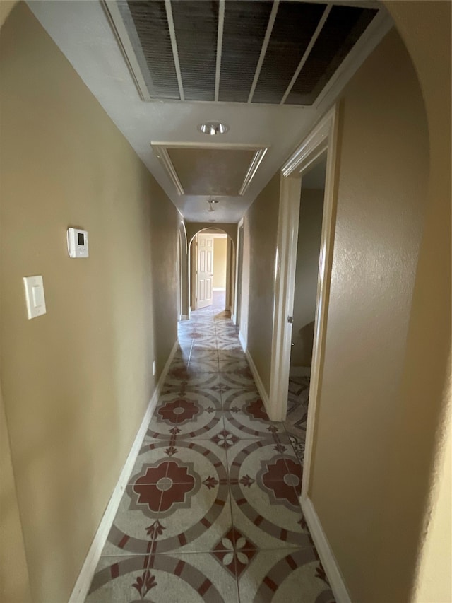 corridor with light tile patterned floors