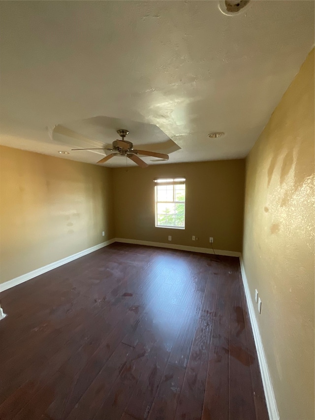 empty room with dark hardwood / wood-style floors