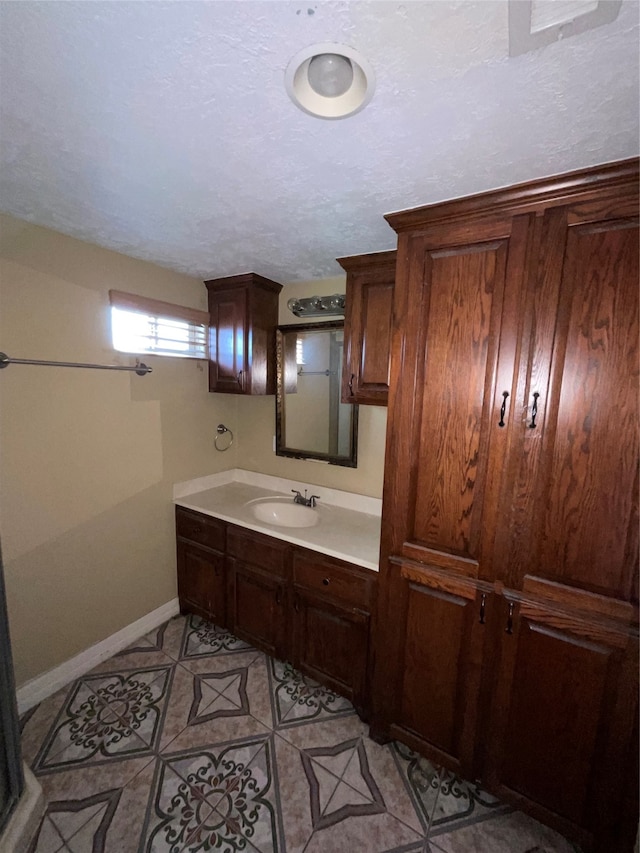 bathroom with tile patterned flooring and vanity