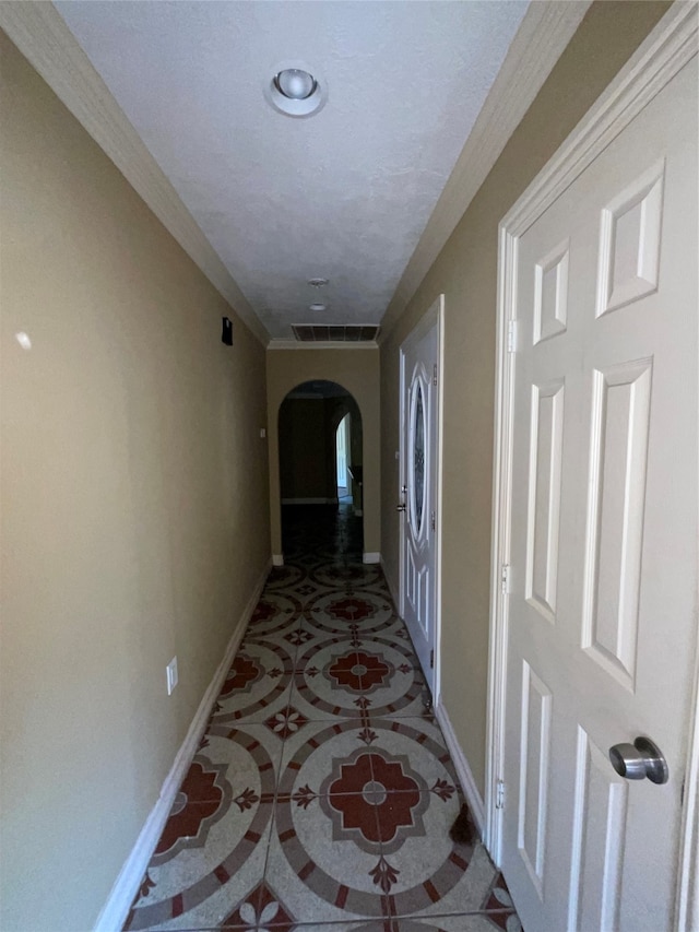 hall featuring a textured ceiling