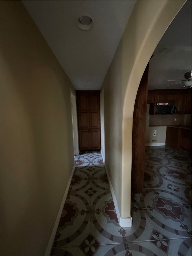 corridor with light tile patterned floors