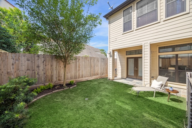 view of yard with french doors