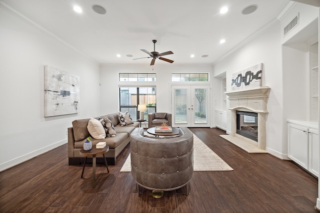 living room featuring ceiling fan, french doors, dark wood-type flooring, and ornamental molding