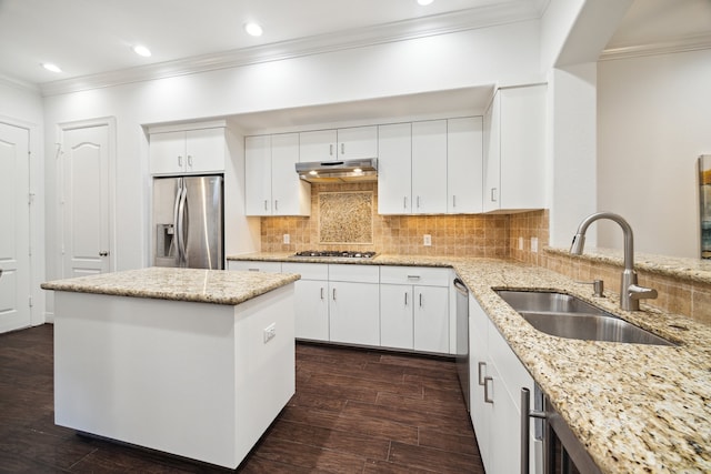 kitchen featuring light stone countertops, dark hardwood / wood-style flooring, stainless steel appliances, sink, and white cabinetry