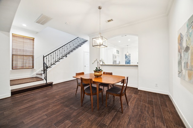 dining room featuring wood-type flooring and ornamental molding