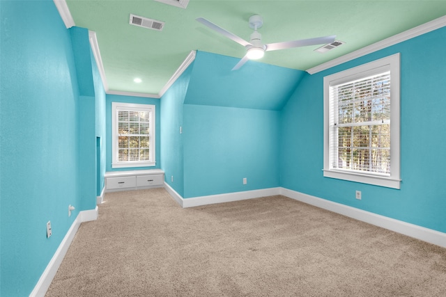 additional living space with light colored carpet, vaulted ceiling, and ceiling fan