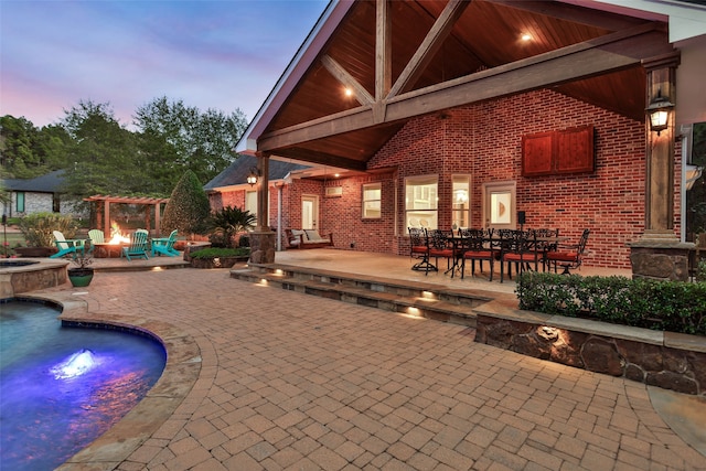 patio terrace at dusk with a fire pit