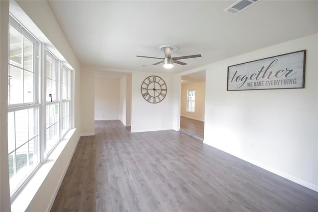 spare room featuring ceiling fan and hardwood / wood-style floors