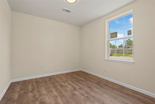 empty room featuring hardwood / wood-style floors