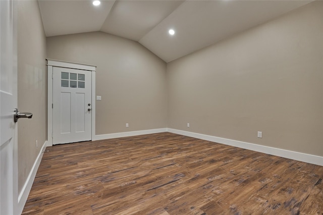 empty room with vaulted ceiling, recessed lighting, baseboards, and dark wood-style flooring