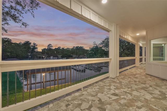 view of balcony at dusk