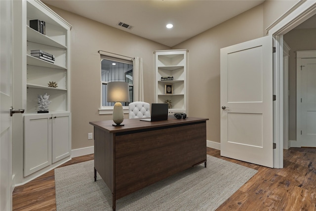 office with recessed lighting, visible vents, baseboards, and dark wood finished floors