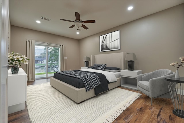 bedroom featuring access to outside, recessed lighting, wood finished floors, and visible vents