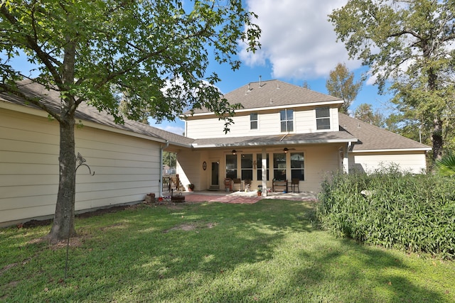 rear view of house featuring a lawn, ceiling fan, and a patio