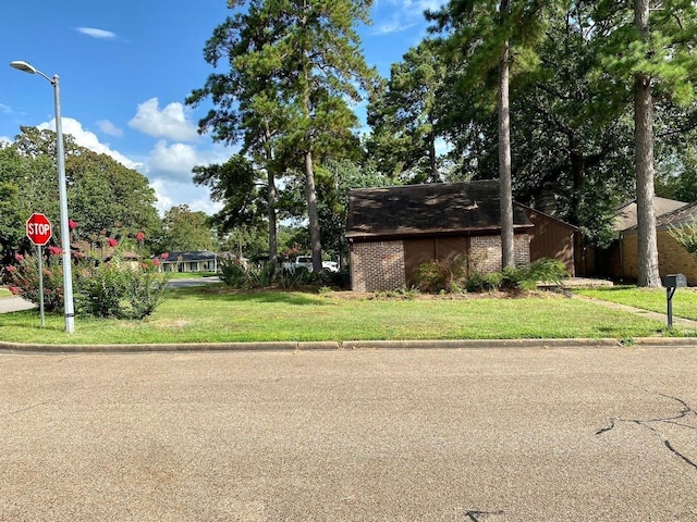 12 Windsor Ct, Lufkin, TX 75901 - view of front of home with brick siding and a front lawn