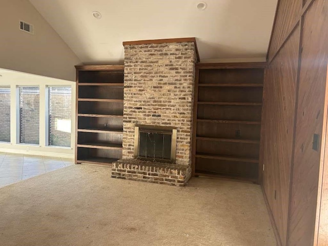 12 Windsor Ct, Lufkin, TX 75901 - unfurnished living room with vaulted ceiling, a fireplace, and carpet floors