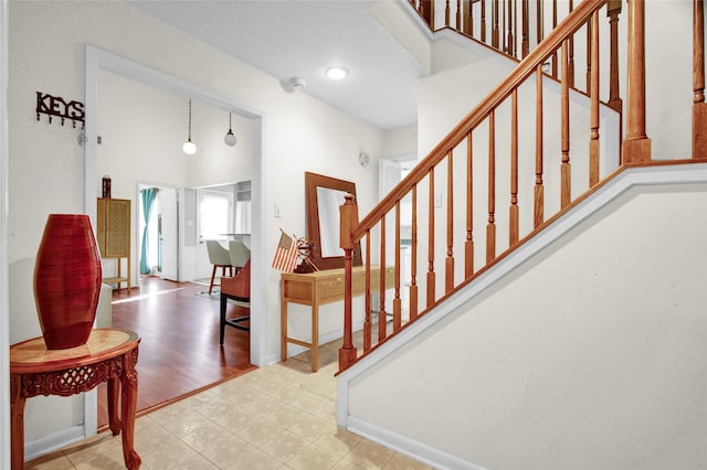 stairs with hardwood / wood-style flooring